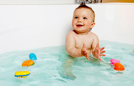 happy baby in bath