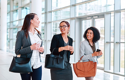 Group of woman carrying handbags on their arms