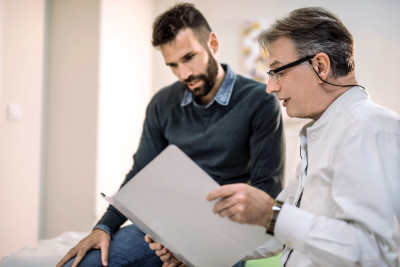 doctor and patient reviewing medical record