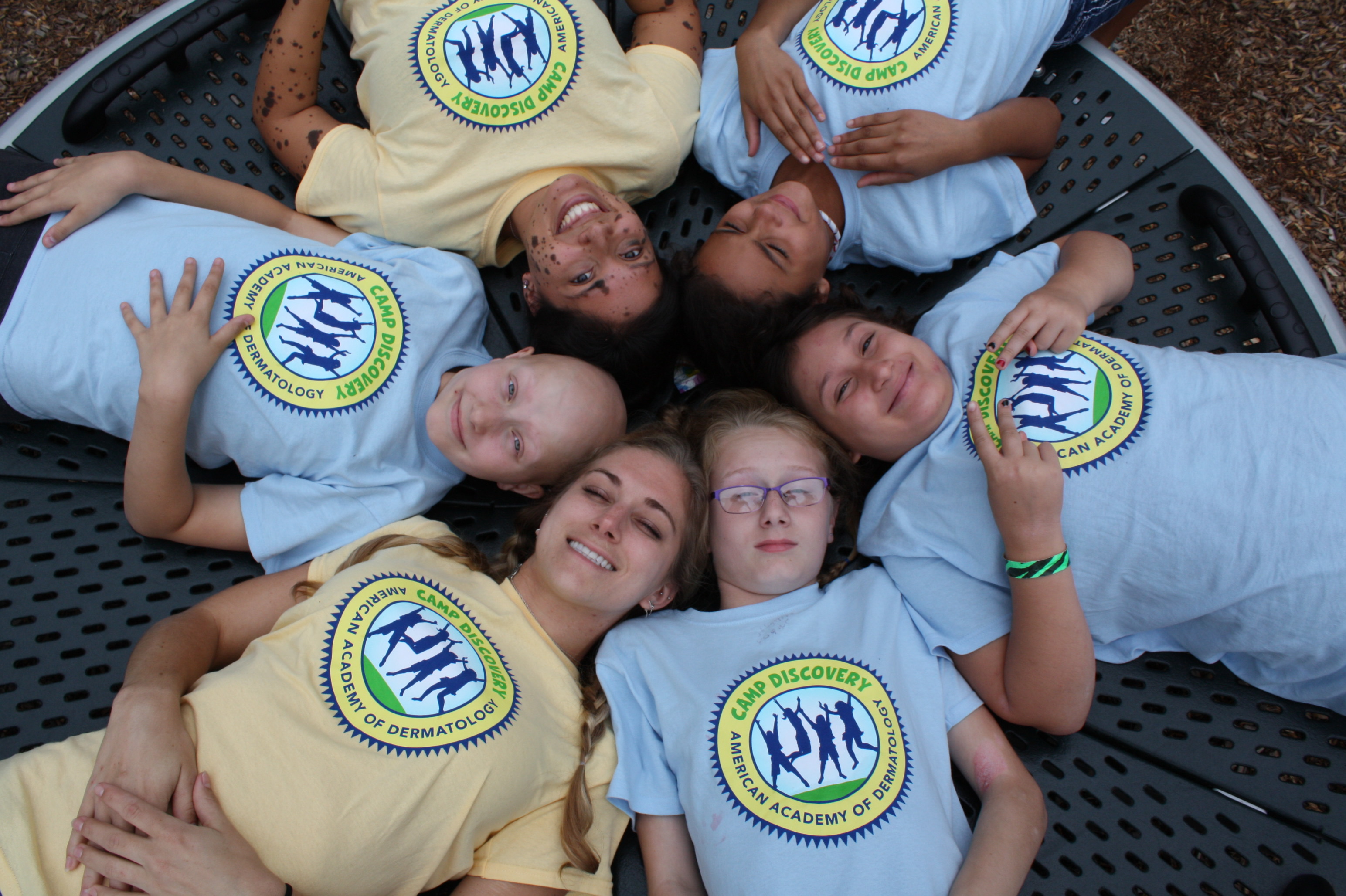 Kids at Camp Discovery on a merry-go-round