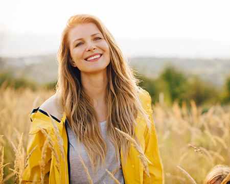 smiling woman in field