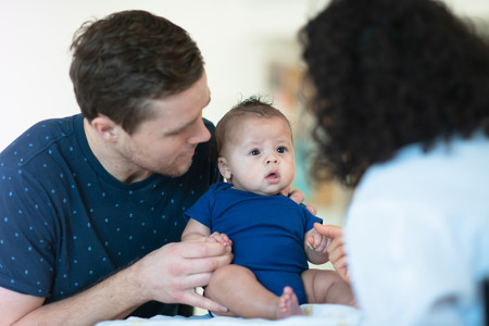 Father and baby seeing a dermatologist