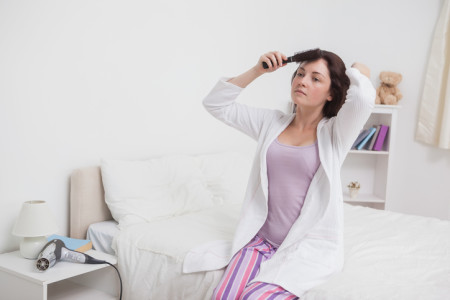 woman brushing her hair