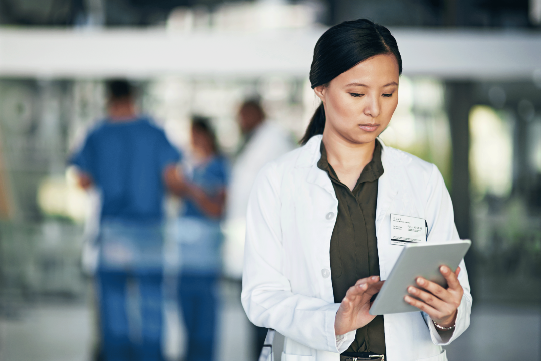 Female doctor using a digital tablet in a hospital