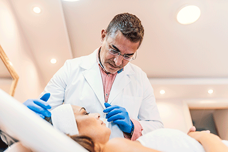 Dermatologist performing a botox treatment on a woman.