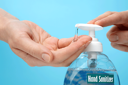 Applying hand sanitizer