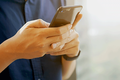 Close-up of man holding a smartphone 