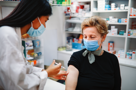 Woman receiving COVID-19 vaccine