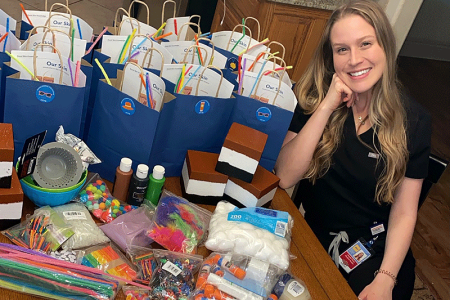 Jessika Sanz, BS, preparing supplies for Good Skin Knowledge teaching project.