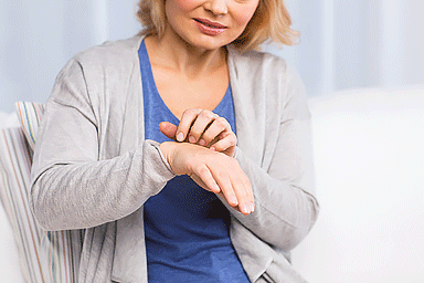 Woman scratching her hand