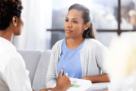 Dermatologist talking with a patient