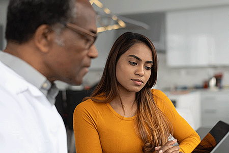 Dermatologist discussing treatment with a patient