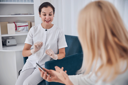 Dermatologist consulting with patient