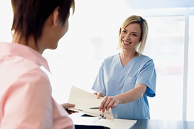 Women at a medical office reception desk