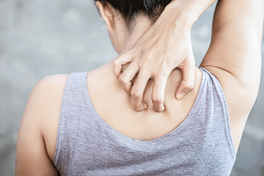 Close-up woman hand scratching her back with skin itchy