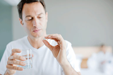 Man taking medication