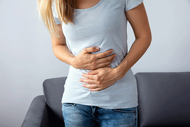 Woman suffering from stomach pain