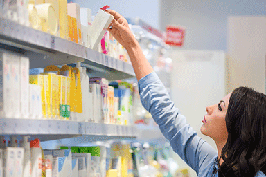 Woman shopping for skin care products in department store