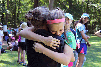 Campers hugging